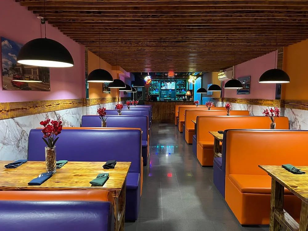 The orange and purple dining booths inside Yucca